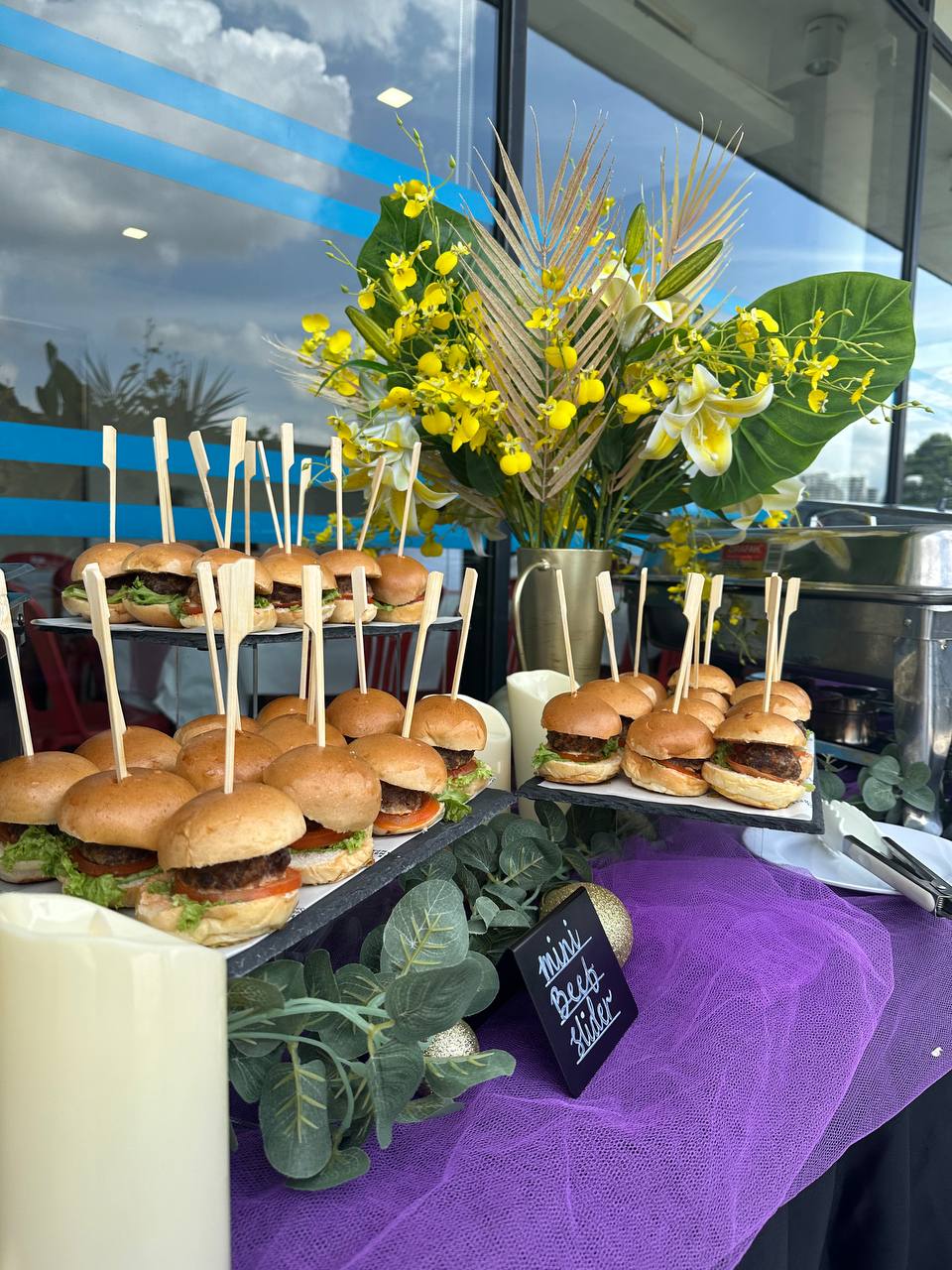 Colorful buffet catering presentation with Malaysian cuisine and finger food